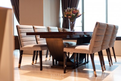 Timeless Malerba dining table with signature bronze arc support base